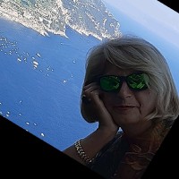Angela E.