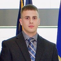 Travis L.