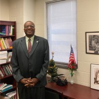 Chris Osuanah, D.B.A., Acue.