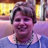 DEBRA B.