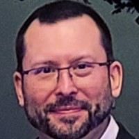 Travis R.