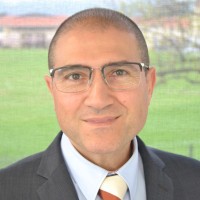 Dr James Economos