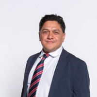 CARLOS B.