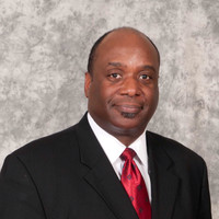 Dr. Charles L. Gill