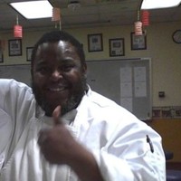 Kevin E Warren
