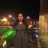 Aarti M