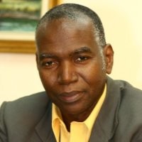 Dr. Silburn Clarke, CLS, FRICS, DFJCS, DBA