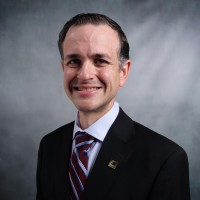 John Rostas, C.M.