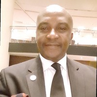 Elvis Enyioko, OD, DOL, PHD, FCE, FJILC, FIMC, CMC