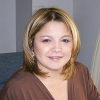 Maria E. Delgado