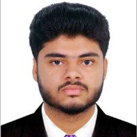 Nisham T