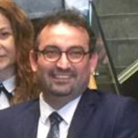 Ali G.