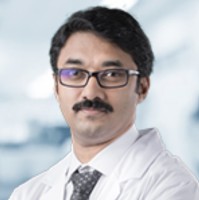 Dr . Anoop T