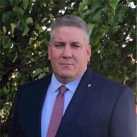 MARK L.