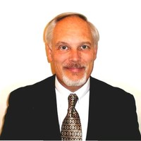 JOHN E. SIKORA