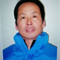 梅建国