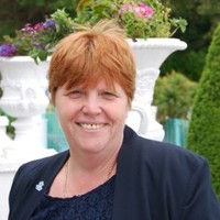 Christine Birch. FCMI