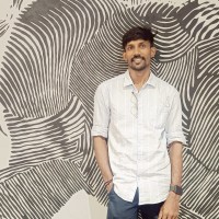 SURYA E