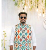 Ujwal B