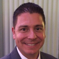 Andy Tscholl, CPCU, CLU, ChFC, FLMI,AIC, AINS