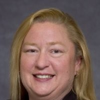 Juli Corbett, Acom