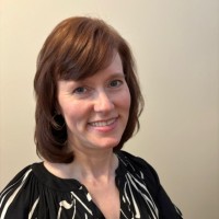 Laura Austgen, Cap, Om (Iaap)