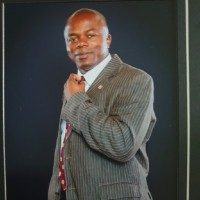 Femi Dada,  BA(Hons), MBA,  FCCA, PhD