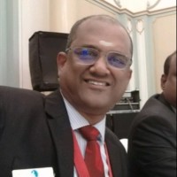 Manickam T