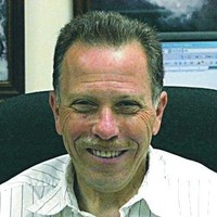 Dr.  John DeCotis