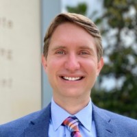 R. Clinton Travis, JD