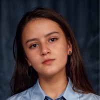 Camila E.