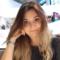 Corina A.