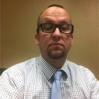 MARK E.