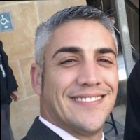 Travis J. Godek