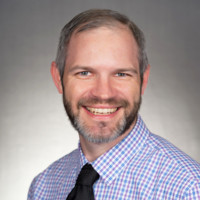 Travis Haneke, Md