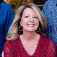 Laurie Christensen, Cap-Om