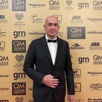 Erhan E.