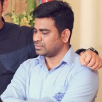 Kamesh E