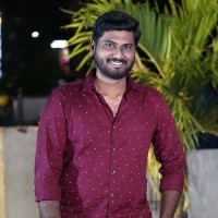 Dinesh E