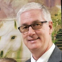 Kevin M Tuttle