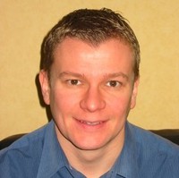 Neil E.
