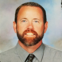 Coach Jacy Holloway