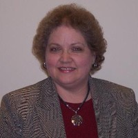 Nancy Holdefer, Cap-Om