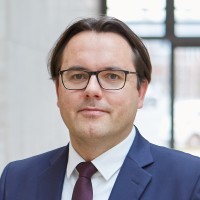 Dr. Christian Brünkmans