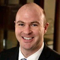 James P. Tomasik, Esq.