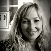 Beate L Hjertenes