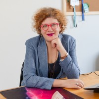 Lyda Michopoulou, ACC (they/them)