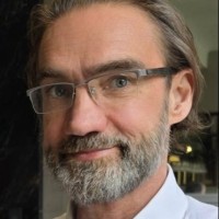 Professor Andrew M Wardley FRCP. FACP(UK).