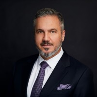 Ernest Michael Cleave, CA(ANZ), CPA, MBA