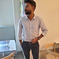 Nidhil K